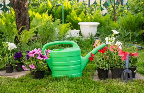 Garden maintenance team using safe tools and handling methods